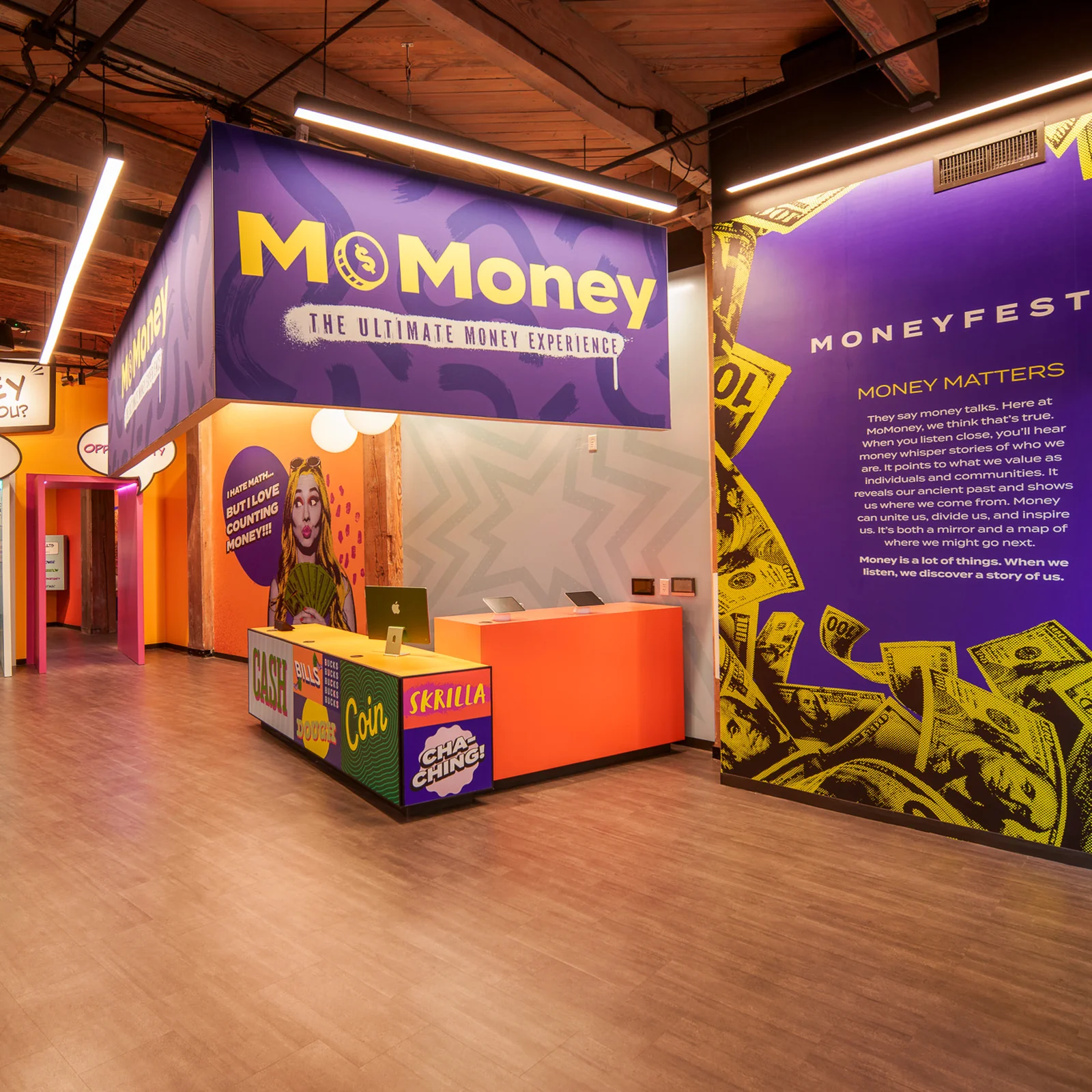Lintshiwe's lobby: purple signage above an orange reception desk, with speech-bubble doorways and the Moneyfesto wall.